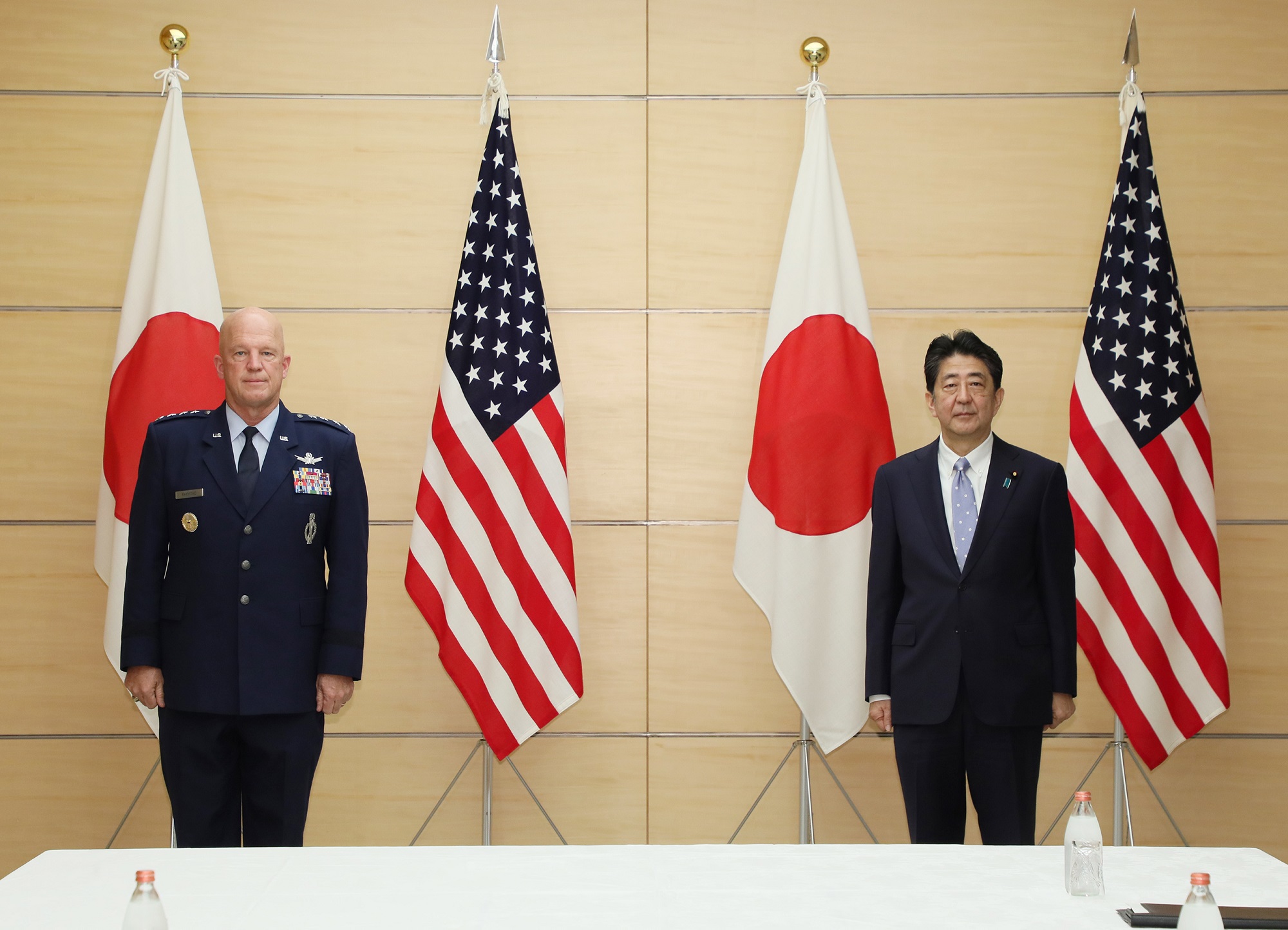 Gen. Jay Raymond, Chief of Space Operations, United States Space Force, and Shinzo Abe, Prime Minister of Japan, in front of U.S. and Japanese flags
